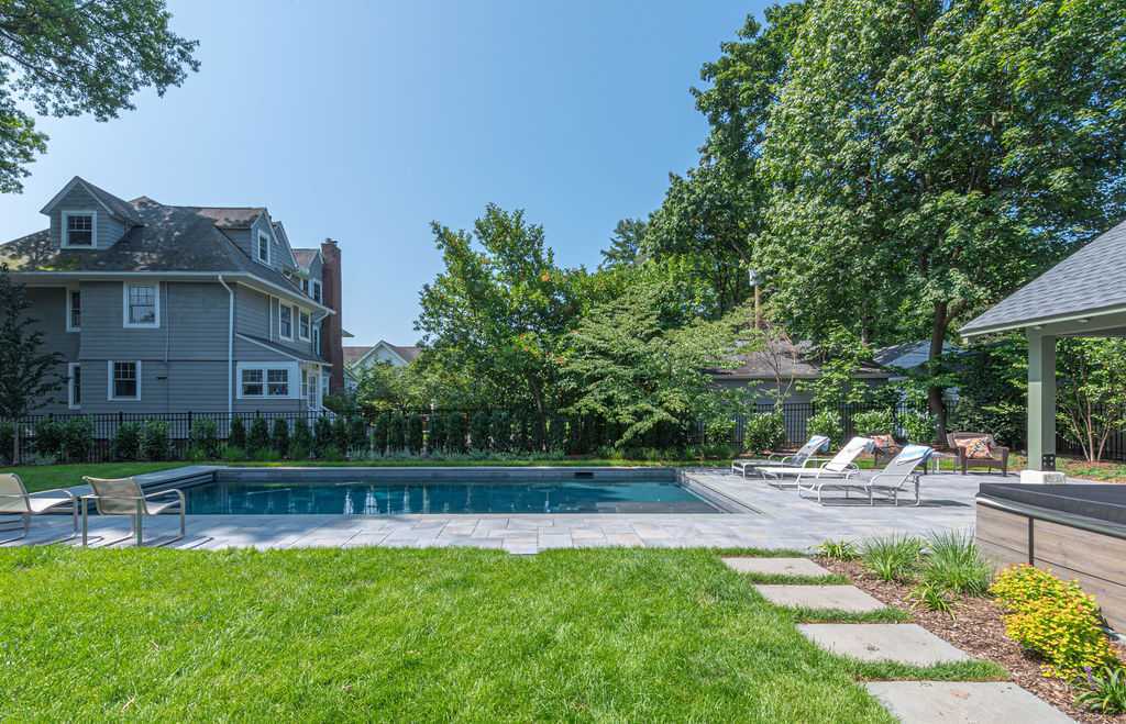 Backyard custom pool installation with sleek patio design by G&L and Sons Renovations in Montclair, NJ