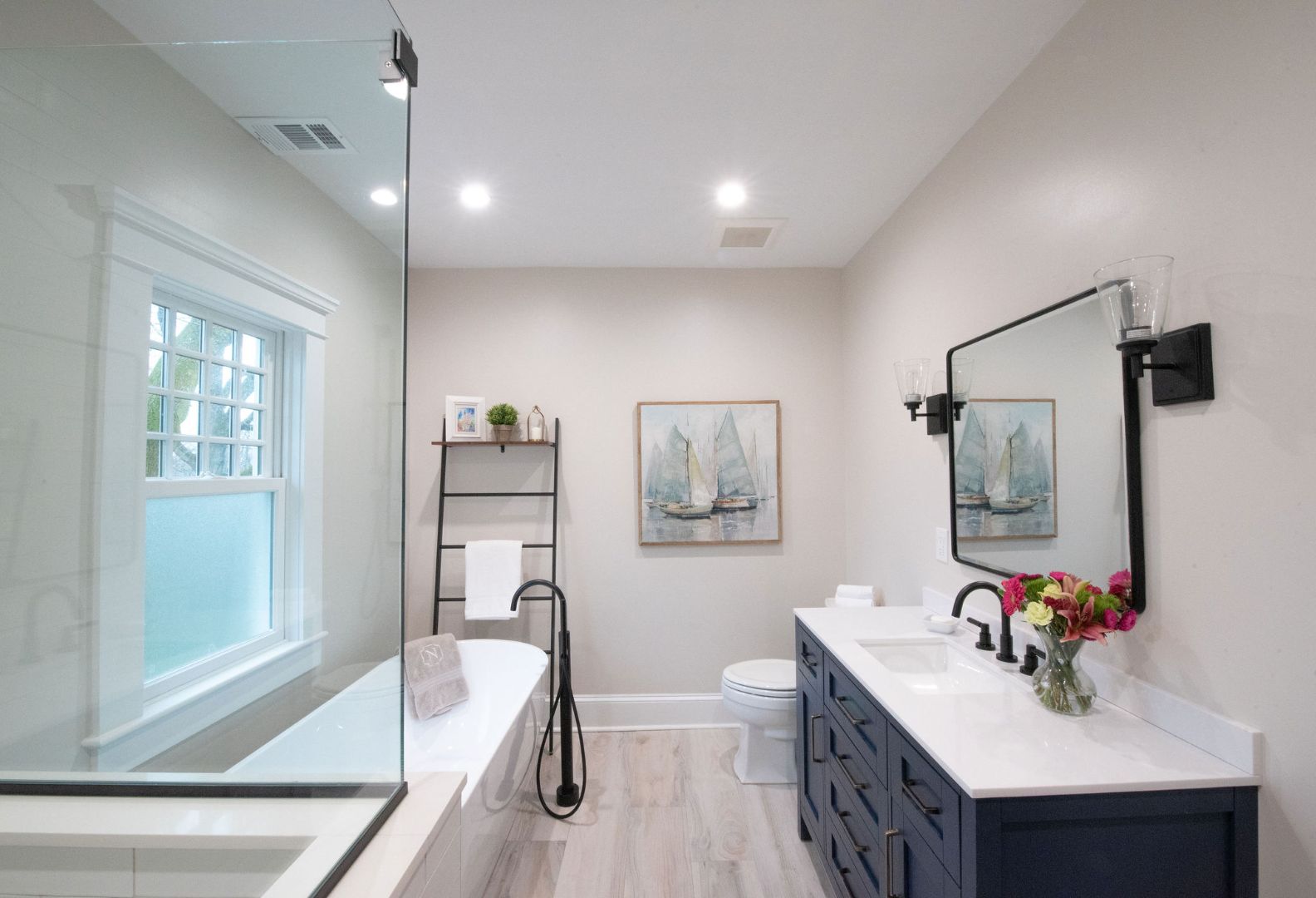 Custom bathroom renovation with glass shower and dual sinks by G&L and Sons Renovations in Montclair, NJ