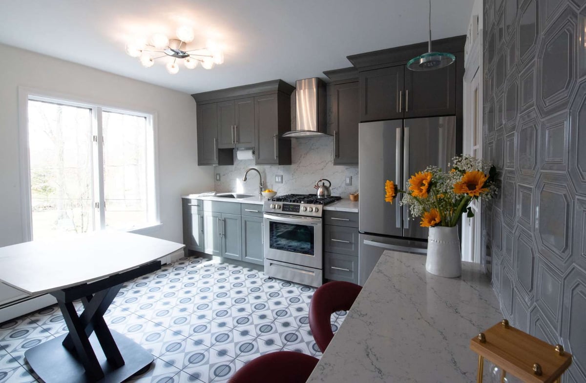 Full view of modern gray kitchen remodel with patterned flooring in Woodland Park, NJ by G&L and Sons Renovations
