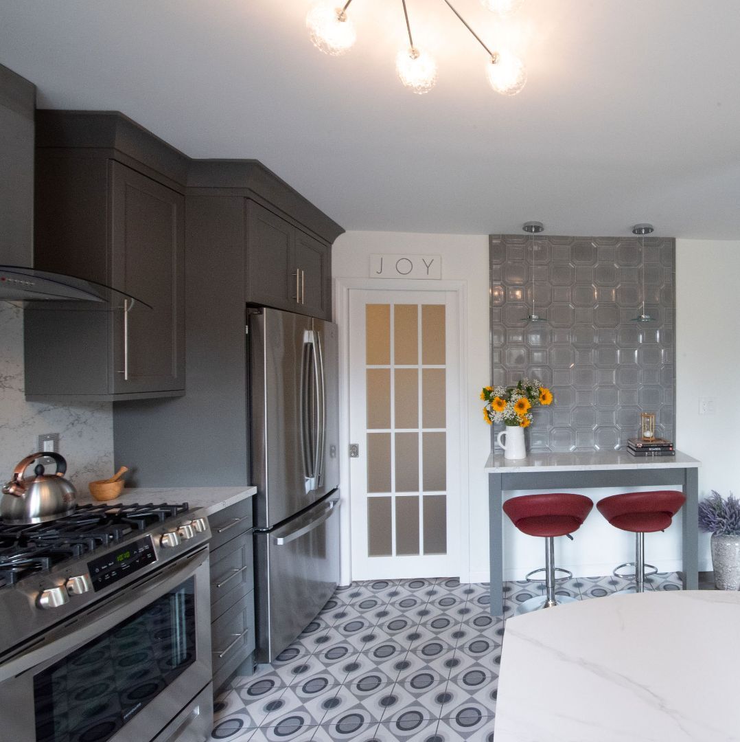 Gray kitchen cabinetry and dining nook remodel in West Caldwell, NJ custom home by G&L and Sons Renovations