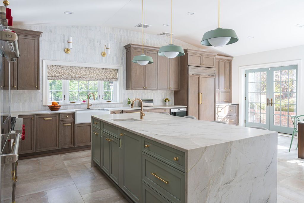 Spacious custom kitchen with two-tone cabinetry and large island by G&L and Sons Renovations in Florham Park, NJ