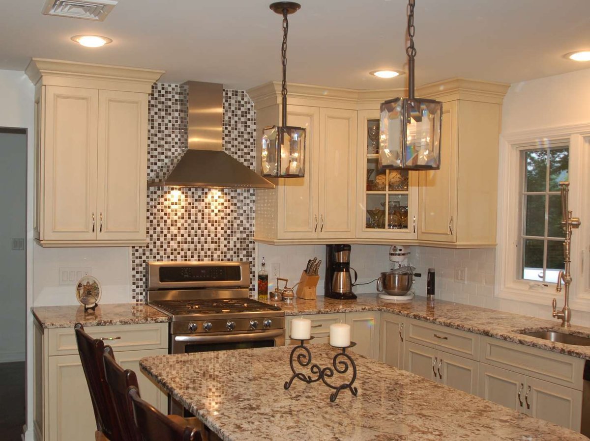 Traditional kitchen design with granite counters and mosaic backsplash in East Hanover, NJ by G&L and Sons Renovations