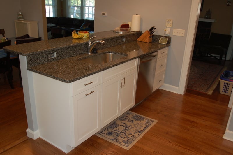 Custom kitchen peninsula with granite countertop and stainless sink by G&L and Sons Renovations in Caldwell, NJ