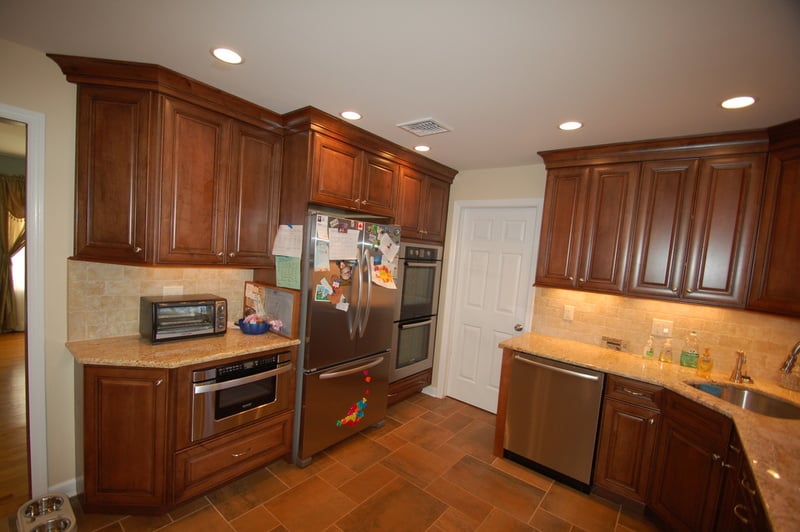 Fully equipped kitchen with built-in double oven and custom wood cabinetry by G&L and Sons Renovations in Caldwell, NJ