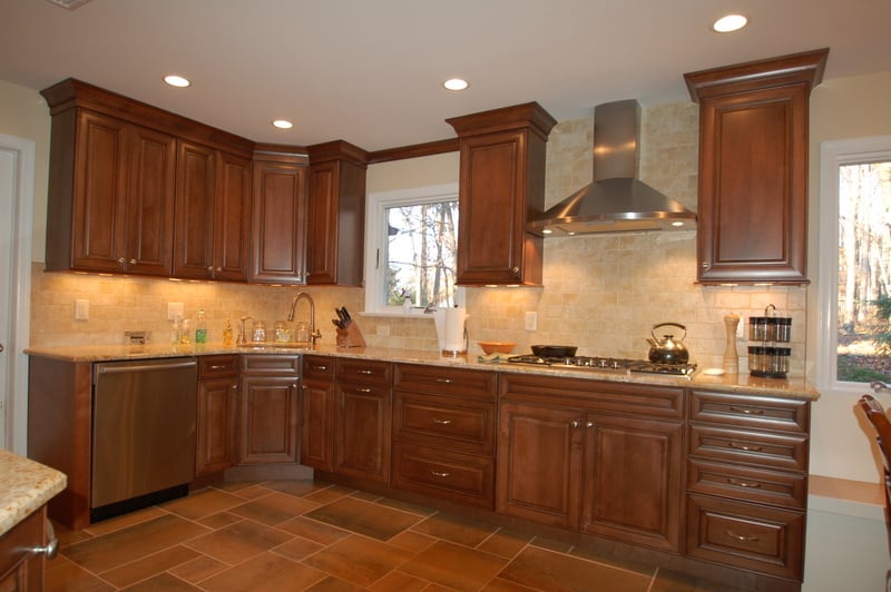 Traditional kitchen remodel with dark wood cabinets and stainless hood by G&L and Sons Renovations in Caldwell, NJ