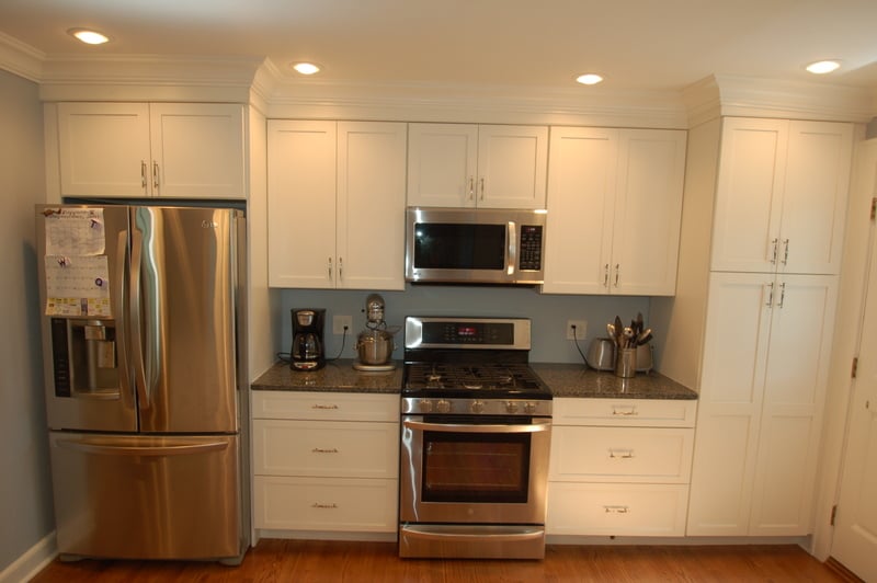 White custom kitchen with stainless appliances and gray wall accents by G&L and Sons Renovations, Caldwell, NJ