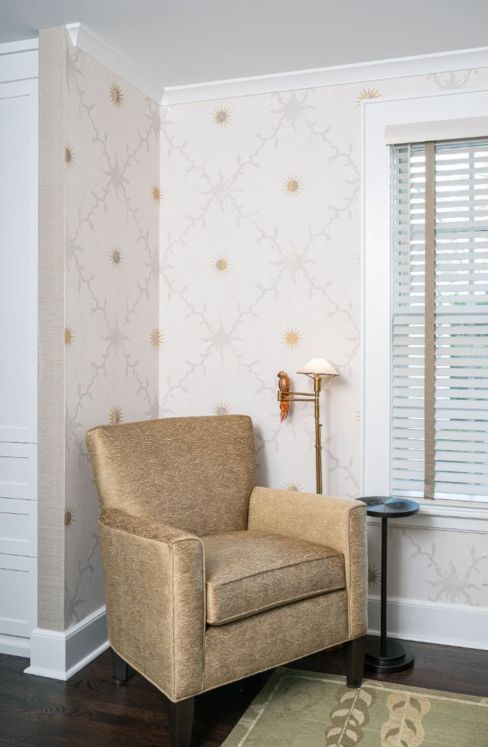 upholstered accent chair beside a window in a house remodeled by G&amp;L and Sons Renovations in Montclair, NJ