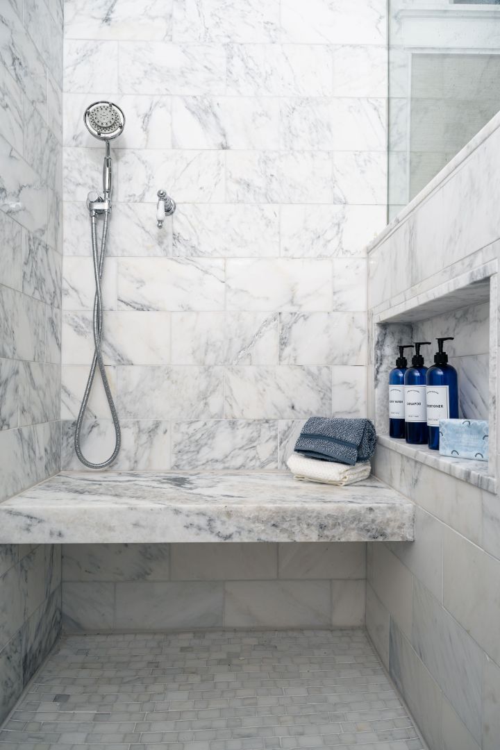 bathroom vanity with marble countertop and chrome fixtures in a house remodeled by G&amp;L and Sons Renovations in Montclair, NJ