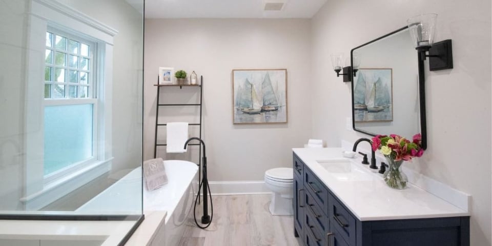 Renovated bathroom in New Jersey with a porcelain vanity and garden tub