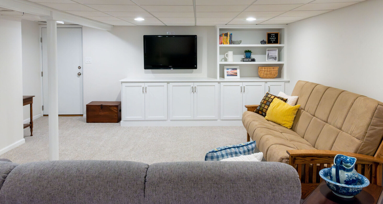 basement-remodel-white-cabinets-couch-in-nery-jersey