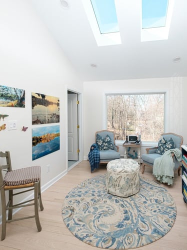 Sunroom addition with skylight windows and hardwood floors